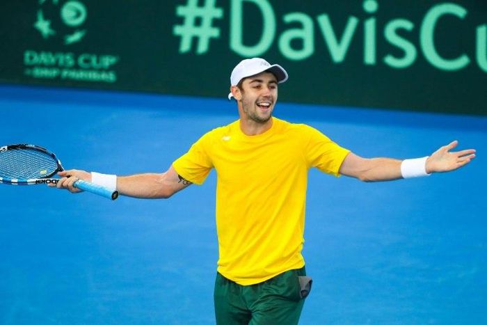 Australia's Jordan Thompson beats Jack Sock of the US in Davis Cup action in front of a raucous crowd on Pat Rafter Arena at the Queensland Tennis Centre