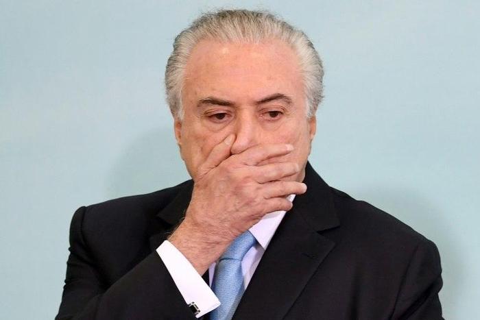 President Michel Temer denied reports that he used the Brazilian intelligence service to dig up dirt on a judge overseeing his corruption case