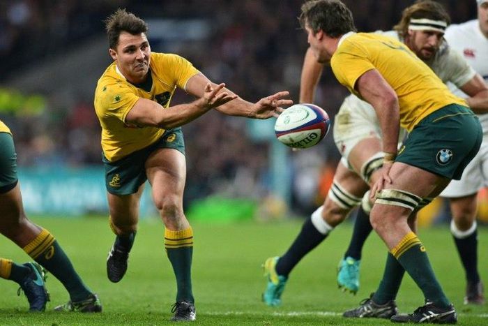 Australia's scrum-half Nick Phipps passes the ball during a rugby union Test match against England, at Twickenham stadium in London, in December 2016