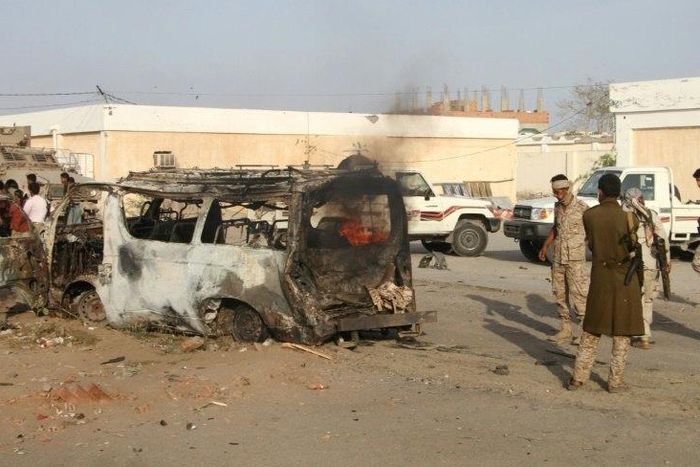 Yemenis check a burning vehicle following a suicide car bombing in Huta, the capital of the southern province of Lahj, a bastion of Al-Qaeda jihadists, on March 27, 2017
