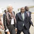International Monetary Fund Managing (IMF) Director Christine Lagarde (C) is escorted by Nigeria's Finance Minister Kemi Adeosun (L) and Nigeria's Central Bank Governor Godwin Emefiele (2nd R) upon arriving at the Nnamdi Azikiwe International Airport i...