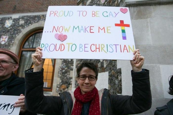 Gay rights campaigners protest outside Church House in London on February 15, 2017