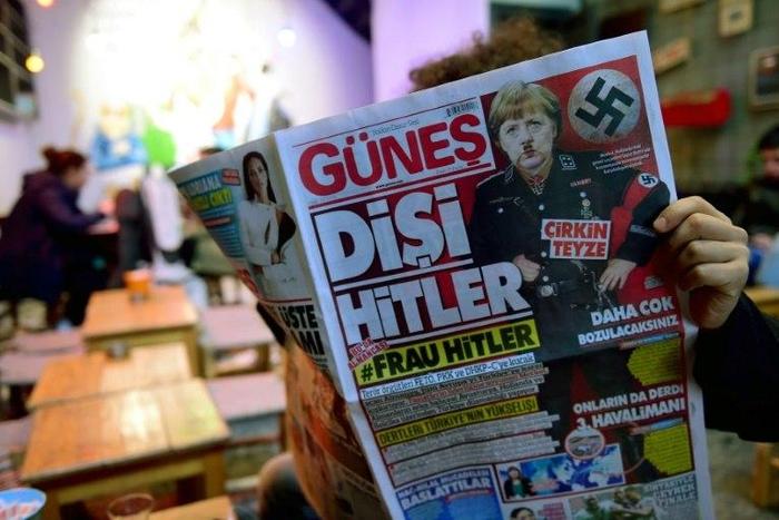 Turkish pro-government daily newspaper Gunes depicts German Chancellor Angela Merkel in a Nazi uniform on March 17, 2017