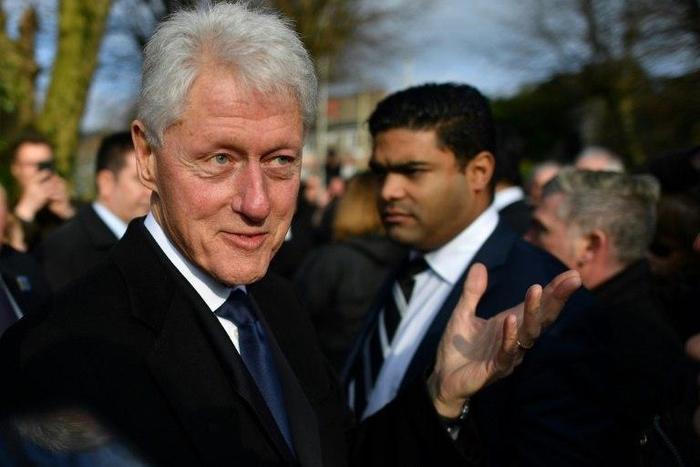 Former US President Bill Clinton speaks to mourners after the funeral of former Northern Ireland Deputy First Minister Martin McGuinness at St Columba's Church Long Tower, in Derry, Northern Ireland on March 23, 2017