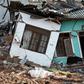 Some 145 homes were destroyed when the 300-foot (90-metre) rubbish mountain came crashing down and police say many more buildings were damaged and could collapse at any time.