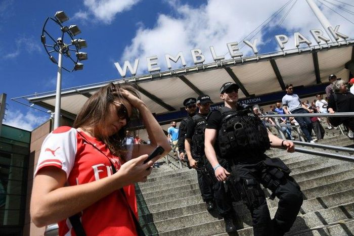 Armed police patrol at Wembley Park Tube Station in London on May 27, 2017 ahead of the English FA Cup final football match between Arsenal and Chelsea