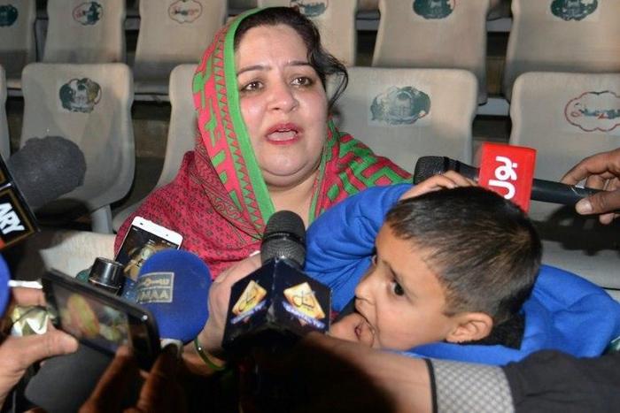 Pakistani mother Rohina Kiani holds her son Ifthikar Ahmed after he was handed over by an Indian official at the Wagah border, on February 4, 2017