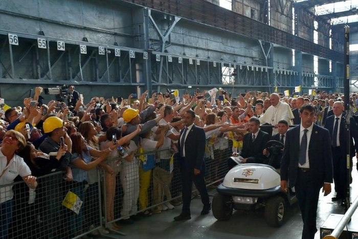Pope Francis received a rapturous reception from workers at a steel plant in Genoa, where he warned against the dangers of financial speculation and a "faceless" economy which discards workers' interests