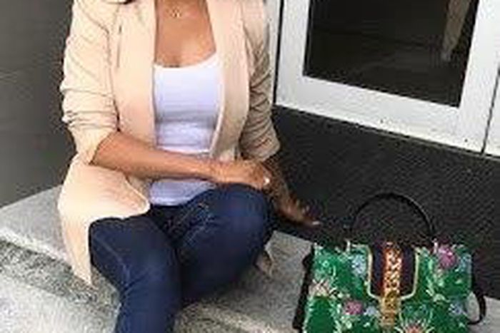 Toke Makinwa shows off her Gucci Sylvie Floral Jacquard Top Handle Bag that retails for $2,250
