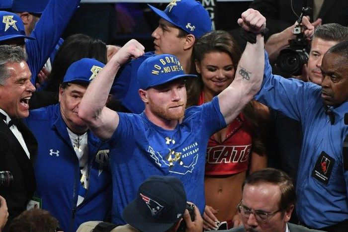 Saul 'Canelo' Alvarez celebrates after defeating Julio Cesar Chavez Jr. by unanimous decision in their catchweight bout, at T-Mobile Arena in Las Vegas, Nevada, on May 6, 2017