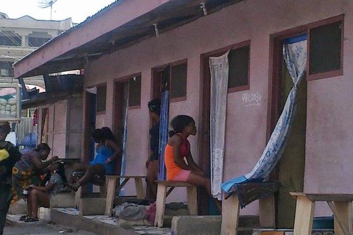 Prostitutes in front of their brothel