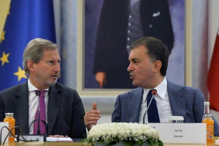 Turkish EU affairs minister, Omer Celik, seen with EU enlargement commissioner Johannes Hahn, blasted EU lawmakers' vote to freeze accession talks as "a politically motivated decision" which was "sabotaging relations"