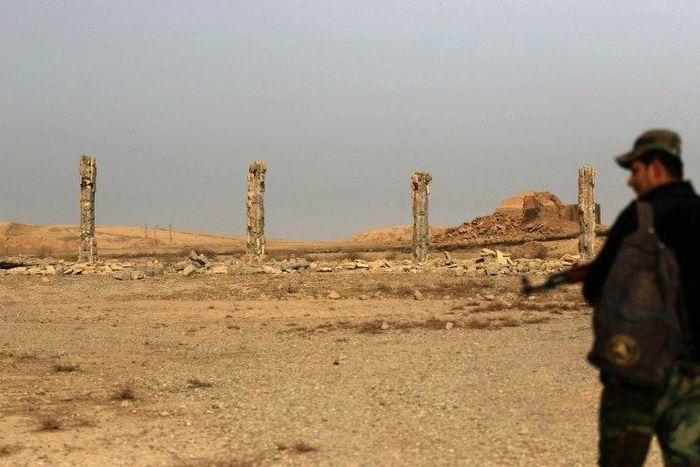 An Iraqi soldier looks at destruction caused by the Islamic State (IS) group at the archaeological site of Nimrud, 30 kilometres south of Mosul, on November 15, 2016, a few days after Iraqi forces retook the ancient city from IS jihadists