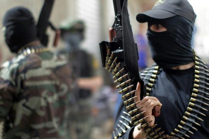 Islamic Jihad fighters chant anti-Israel slogans during a 2013 rally in the Gaza Strip refugee camp of Jabalia