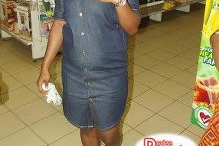 Happily showing off her new engagement ring