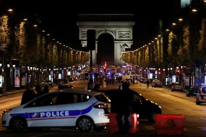 The gunman opened fire on a police van just a few hundred metres from the iconic Arc de Triomphe
