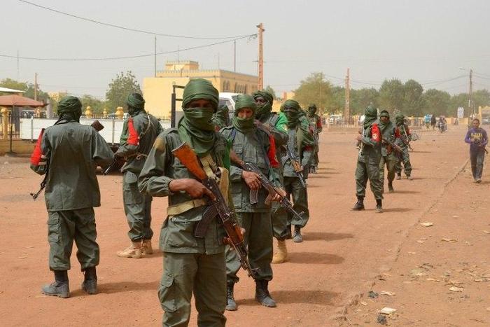 Malian army soldiers, pro-government militia members and former rebels, predominantly Tuaregs, take part in their first joint patrol in Gao in northern Mali on February 23, 2017