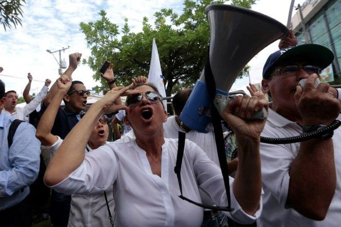 Supporters of opposition candidate Guillermo Lasso gather in front of the National Electoral Council in Guayaquil, Ecuador on April 3, 2017