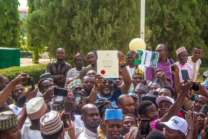 Dino Melaye receives his certificate from ABU