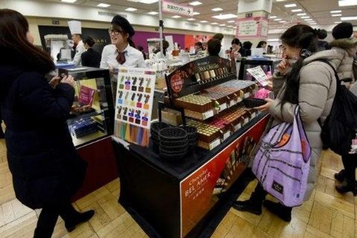 Women in Japan mark Valentine's Day by buying so-called 'obligation chocolate' for boyfriends, husbands, colleagues and bosses