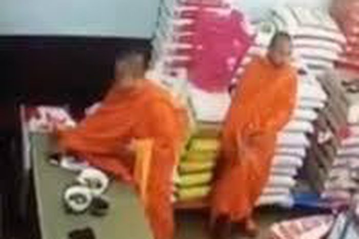Monks stealing iphone in a rice shop