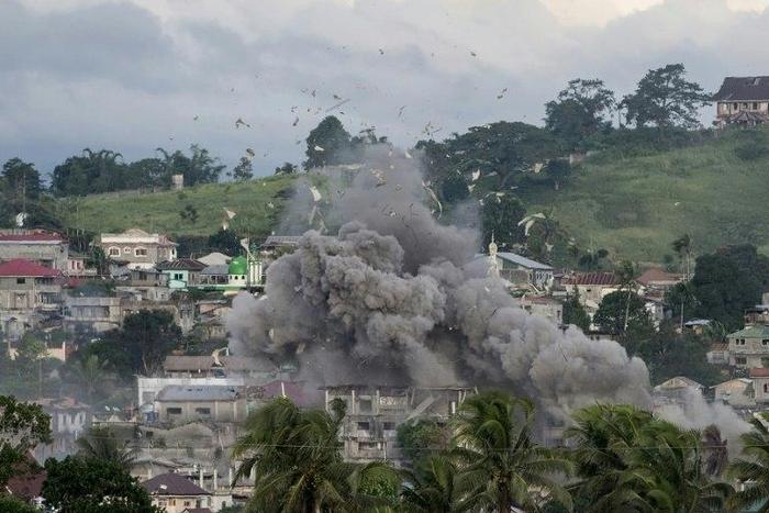 A bomb explodes after being dropped on an Islamist militants' hideout in Marawi, on the southern Philippine island of Mindanao