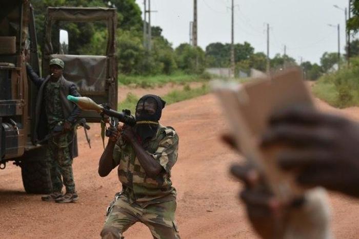 A mutinous soldier holds a RPG rocket launcher inside a military camp in the Ivory Coast's central second city Bouake, on May 15, 2017