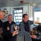 Britain's Home Secretary Sajid Javid (L) talks with UK Border Force staff onboard of Border Force cutter, HMC Searcher, on the Dover Strait off the coast of Dover, in south-east England