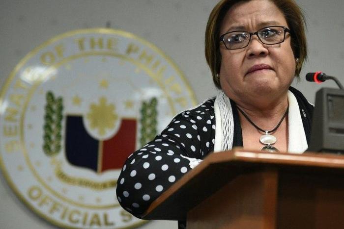 Philippine Senator Leila De Lima fights back tears as she speaks to reporters in Manila, on February 23, 2017