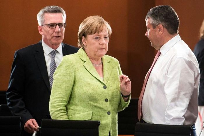 German Chancellor Angela Merkel (C), Interior Minister Thomas de Maiziere (L) and Vice Chancellor and Foreign Minister Sigmar Gabriel attend a meeting with the state Premiers of the German Federal states at the Chancellery on June 1, 2017
