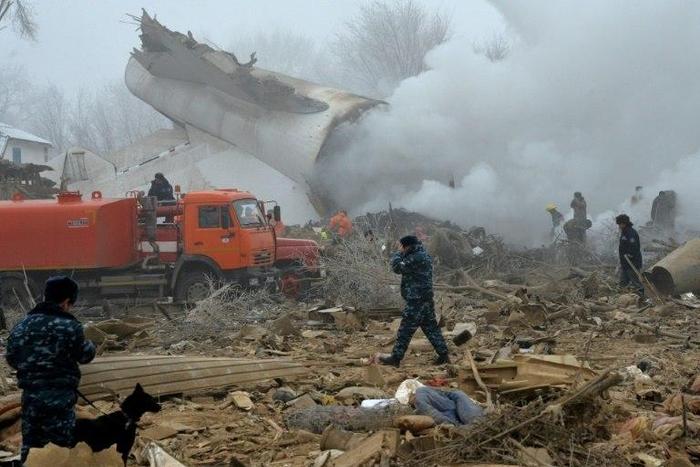 Rescue personnel work at the crash site of a Turkish cargo plane in the village of Dacha-Suu outside Bishkek, Kyrgyzstan