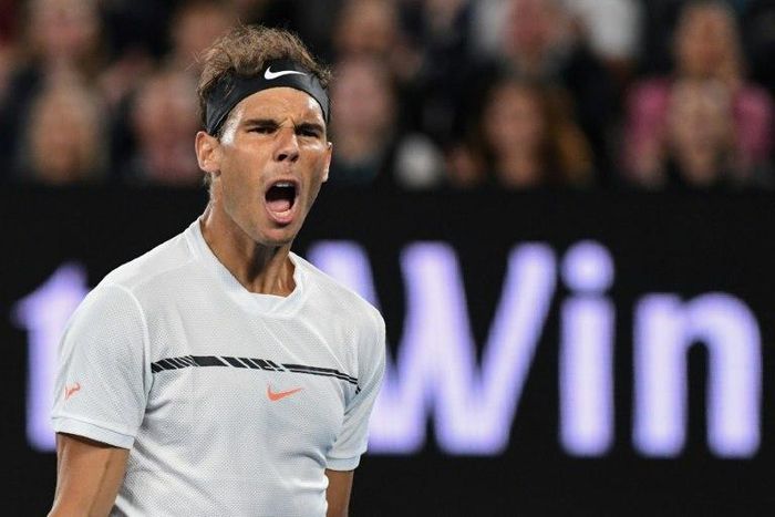 Spain's Rafael Nadal celebrates after scoring a point against Canada's Milos Raonic during their Australian Open quarter-final match, in Melbourne, on January 25, 2017