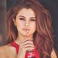 Selena Gomez sipping from a bottle of Coca-Cola.