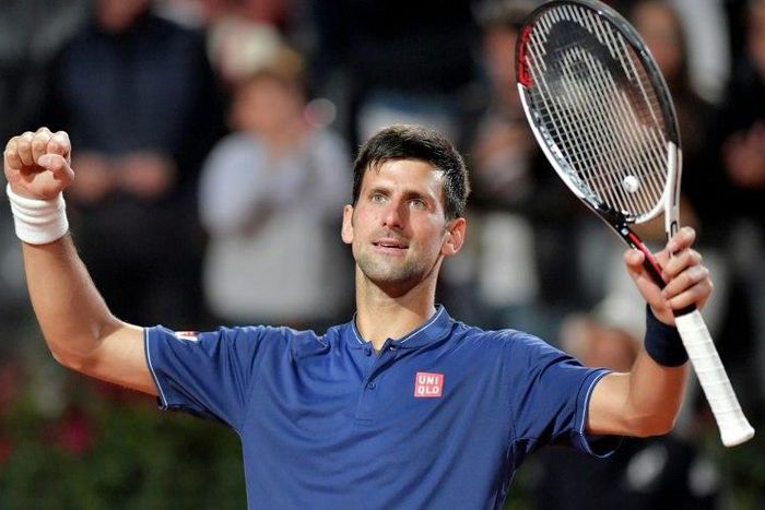 Novak Djokovic of Serbia celebrates after winning the semi-final match against Dominic Thiem of Austria at the ATP Tennis Open tournament, on May 20, 2017 at the Foro Italico in Rome
