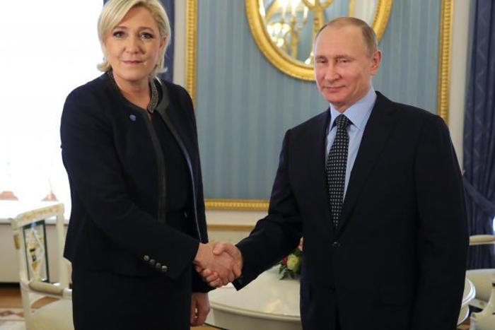 Russian president, Vladmir Putin  shakes hands with French presidential candidate, Marine Le Pen.