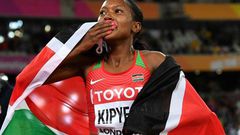 Kenya's Faith Kipyegon celebrates after winning the final of the women's 1,500m at the 2017 IAAF World Championships in London on August 7, 2017