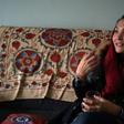 Afghan swimmer and coach Elena Saboori, head of the newly created Women's Swimming Committee, gestures as she speaks during an interview with AFP in a house in Kabul