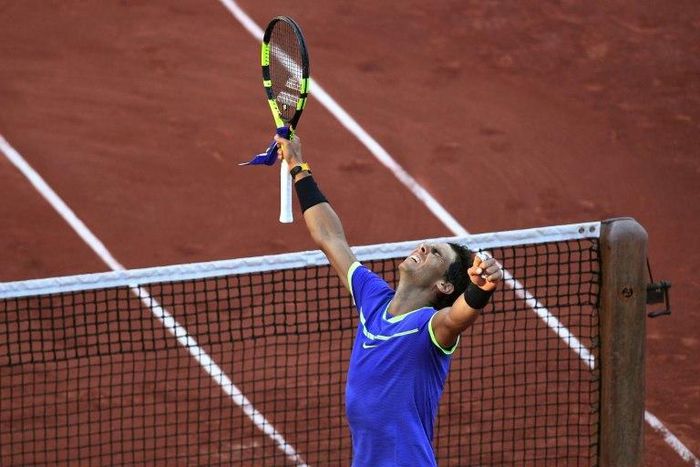 Spain's Rafael Nadal celebrates after winning his semifinal tennis match against Austria's Dominic Thiem at the Roland Garros 2017 French Open on June 9, 2017 in Paris