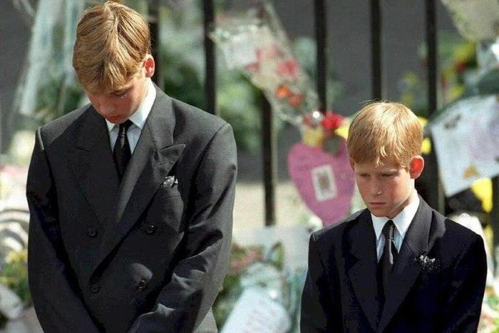 Prince William (left) and Prince Harry bow their heads during the funeral of their mother Diana, Princess of Wales, at Westminster Abbey in 1997