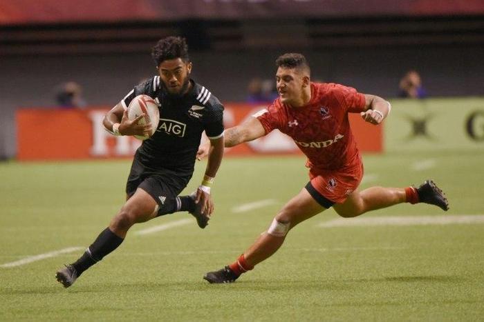 New Zealand (in black) and Canada compete during the HSBC Canada Sevens Vancouver tournament, at BC Place Stadium, on March 11, 2017