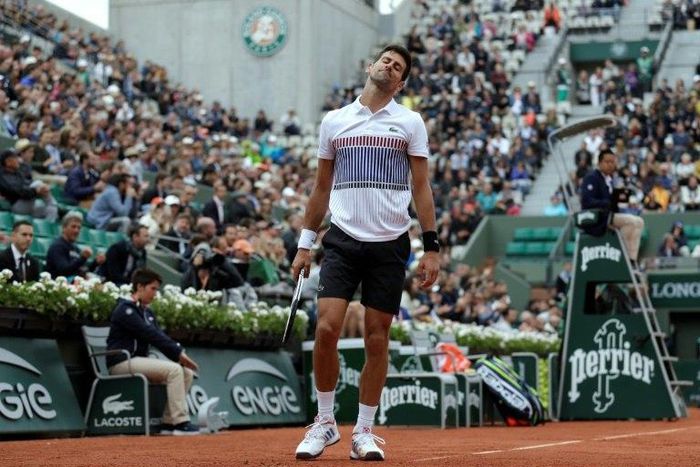 Serbia's Novak Djokovic reacts during his tennis match against Austria's Dominic Thiem at the French Open on June 7, 2017