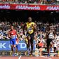 Jamaica's Usain Bolt (C) race to victory on the anchor leg ahead of Canada's Mobolade Ajomale (R) and Cuba's Jose Luis Gaspar to win their heat in the 4x100m relay at the IAAF World Championships at the London Stadium in London, on August 12, 2017