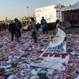 A girl drags a banner reading "yes" across piles of "yes" leaflets in the Kadikoy district of Istanbul