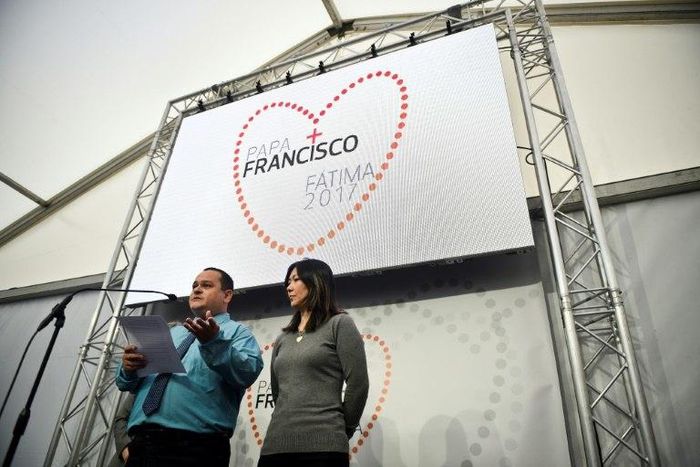 Joao Batista (L) and Lucila Yurie, parents of a miraculously healed child, give a press conference at Fatima, central Portugal, on May 11, 2017