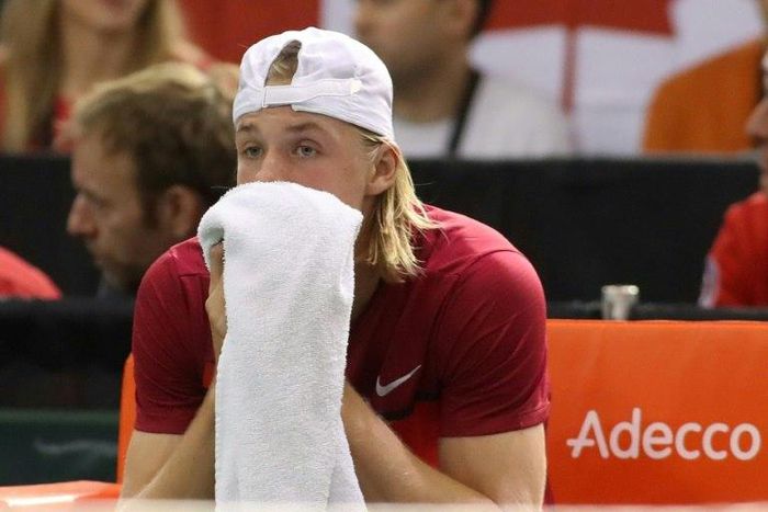 Denis Shapovalov of Canada reacts after accidentaly hitting the head referee Arnaud Gabas on February 5, 2017