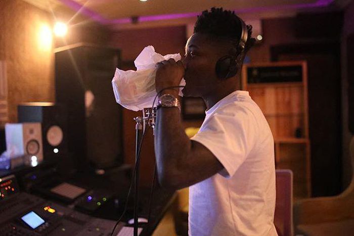 Reekado Banks recording a new song at the Mavin Records studio.