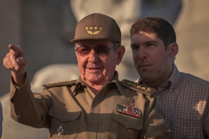 Cuban President Raul Castro, next to his grandson and bodyguard, attends the May Day parade in Havana on May 1, 2017