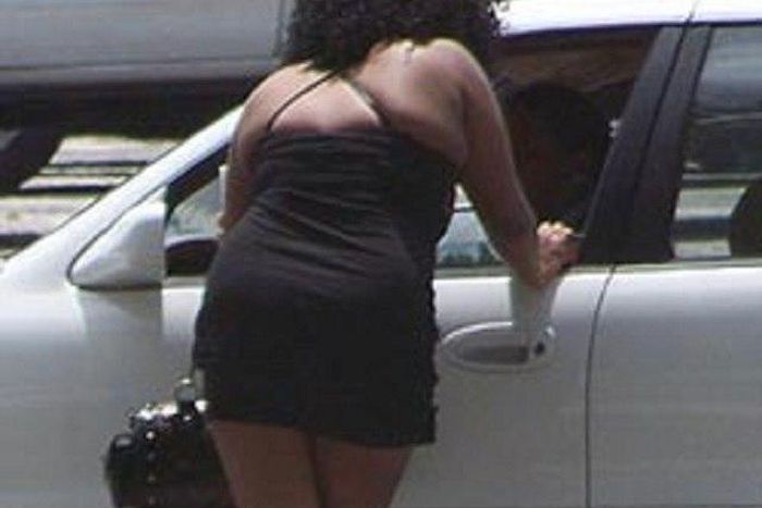 A prostitute negotiating with her customer