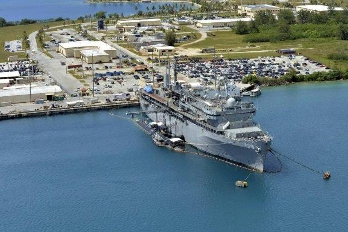 This image obtained from the US Department of Defense shows the submarine tender USS Emory S. Land and the Los Angeles-class attack submarine USS Topeka pierside in their home port at Polaris Point, Guam