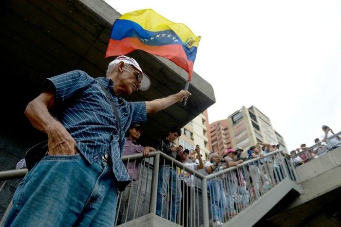 Opposition activists protest against the government in Caracas on May 12, 2017